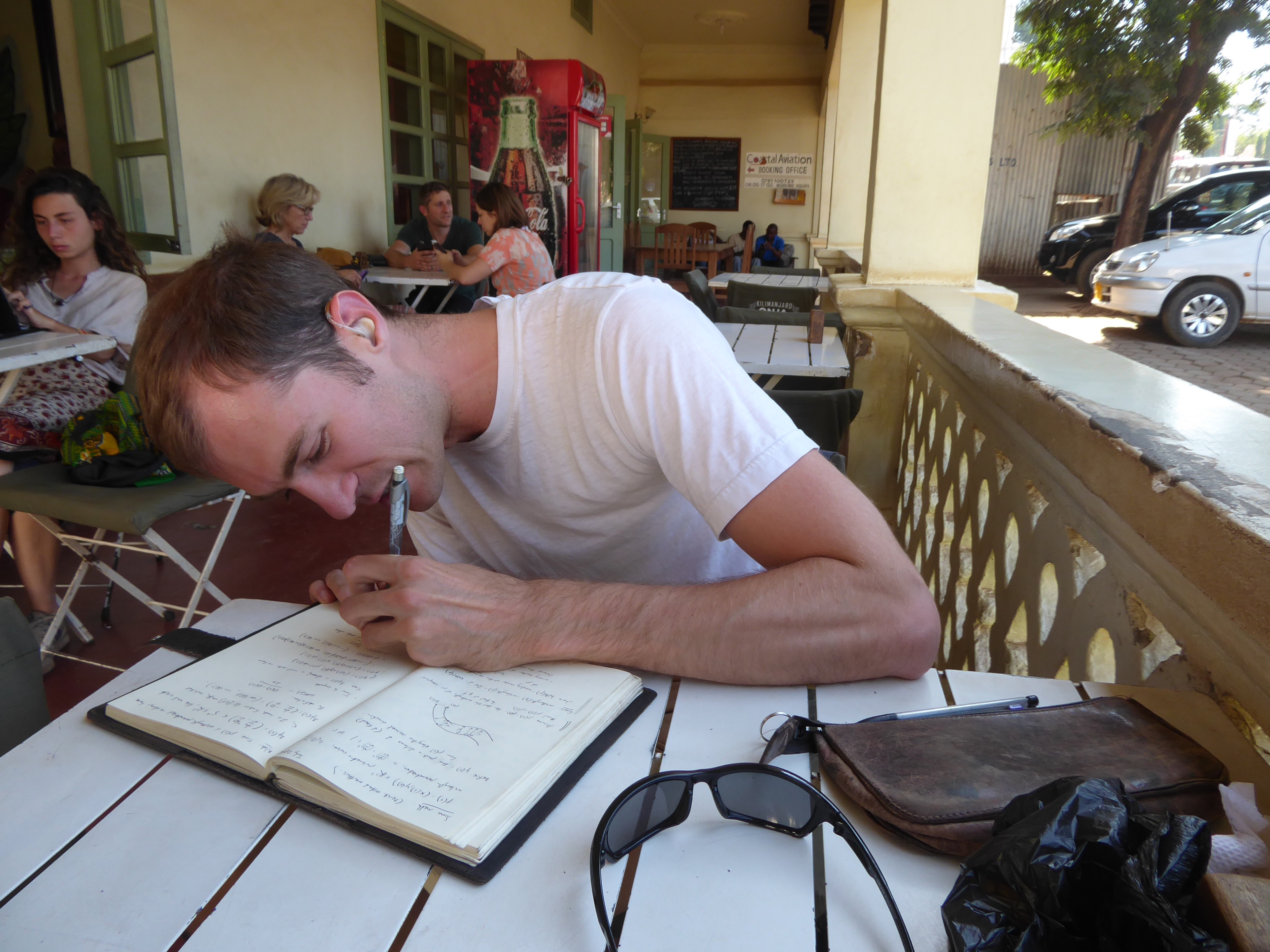 Left: Jake sketching ideas in a cafe in Moshi. Right: how we spent the rest of our time.